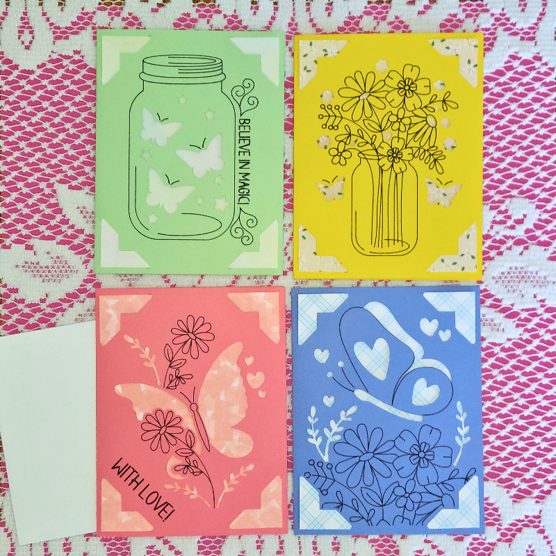 Four colorful cards with illustrations on a patterned background