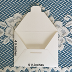 White envelope with measurements on a textured blue and white background