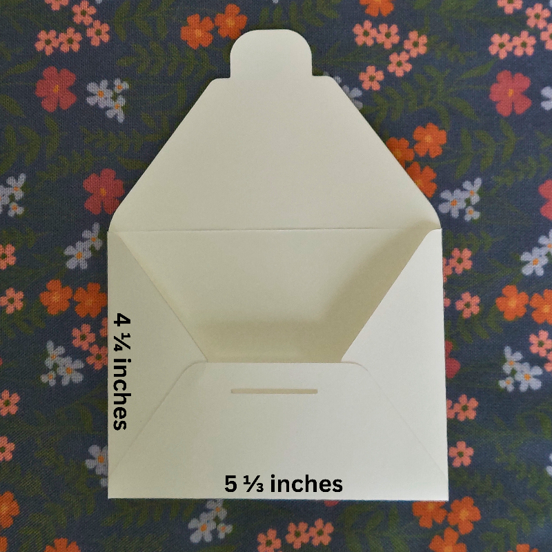 White envelopes with measurements on a floral background