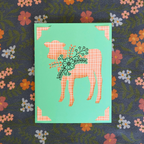 Card with a cow illustration on a floral background