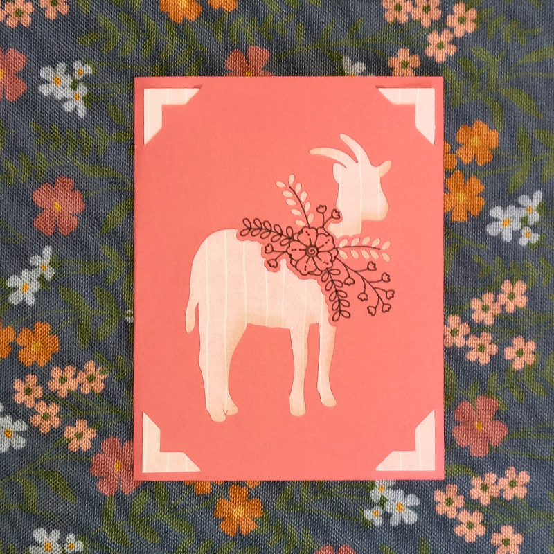 Card with a goat illustration on a floral patterned background