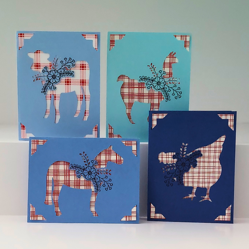 Four decorative cards with farm animal silhouettes on blue backgrounds.