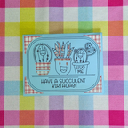 Cartoon succulents with a birthday message on a colorful checkered background