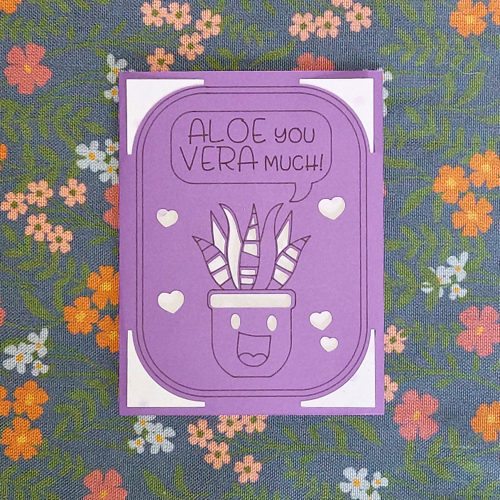 Purple card with a plant illustration and text 'Aloe you vera much!' on a floral background
