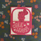 Card with a cactus illustration and 'Hug Me Free Hugs!' text on a floral background