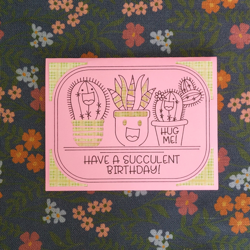 Pink card with succulent illustrations and text on a floral background