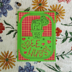 Card with a cactus illustration and text 'Hug Me! I Free Hugs' on a floral background