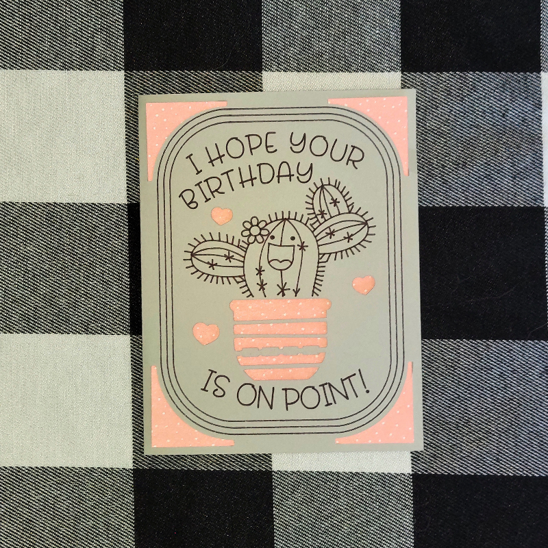 Birthday card with cactus illustration on a checkered fabric background
